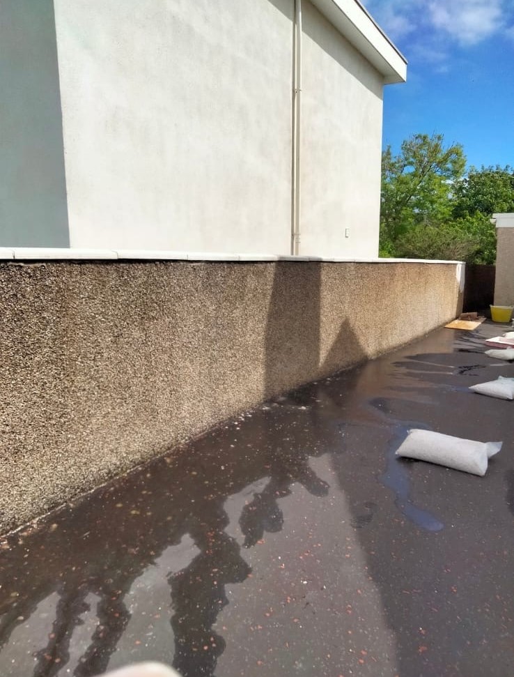 Dry roughcast on wall before work has been done.